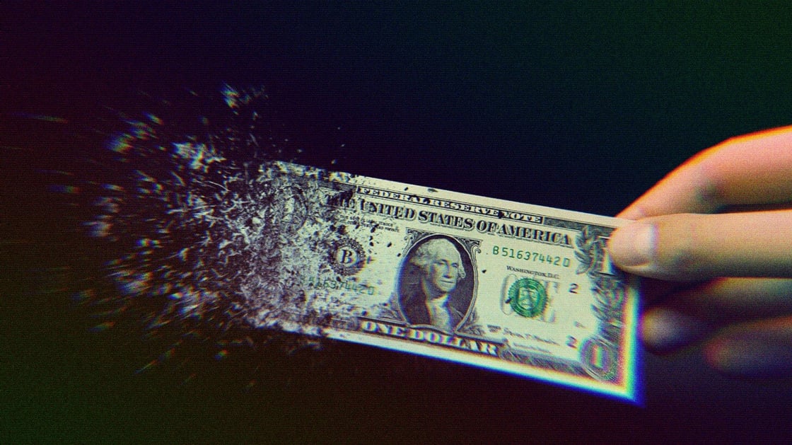 A dollar bill disintegrating.