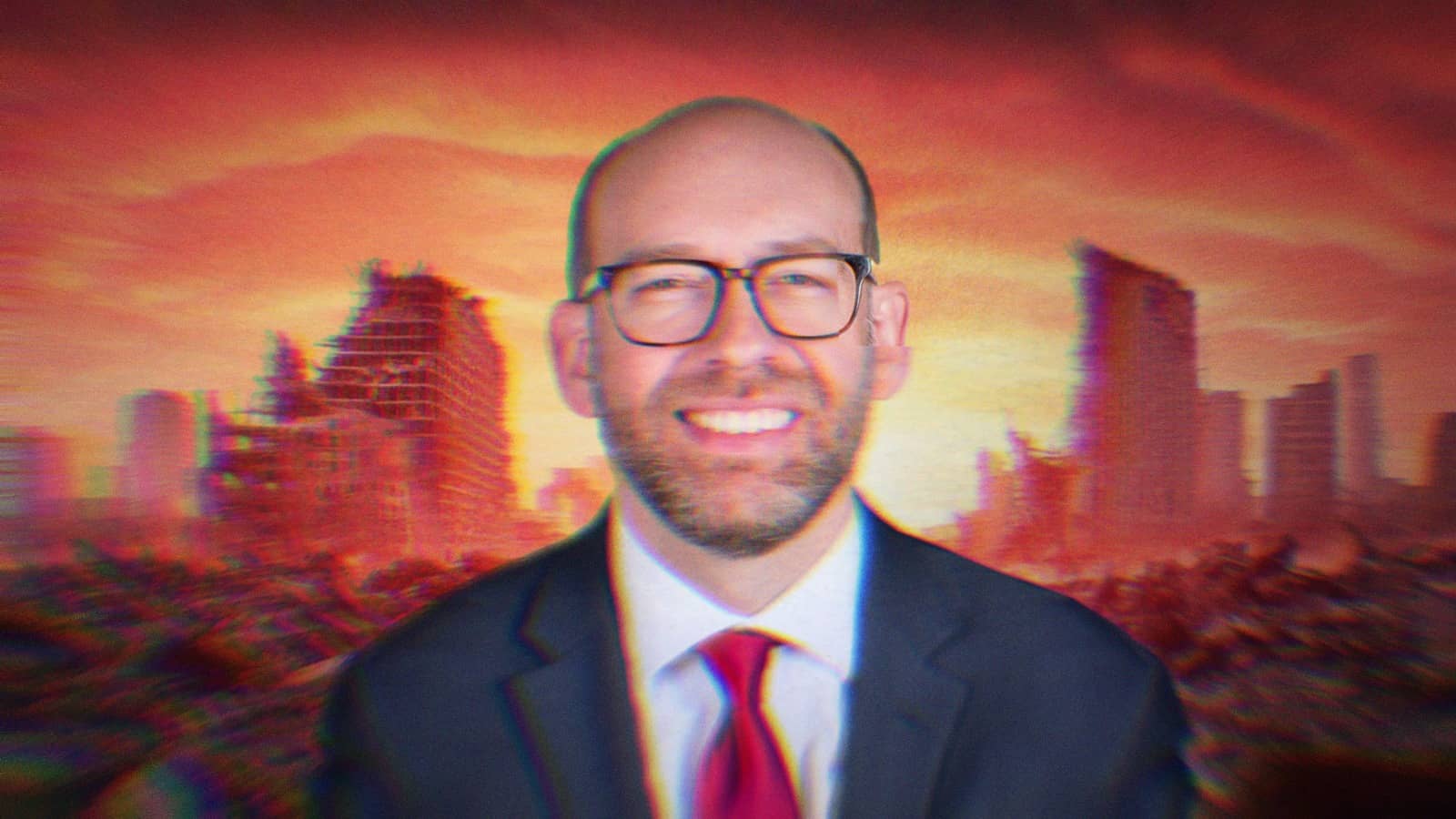 Russell Vought smiling in front of an apocalyptic city background.