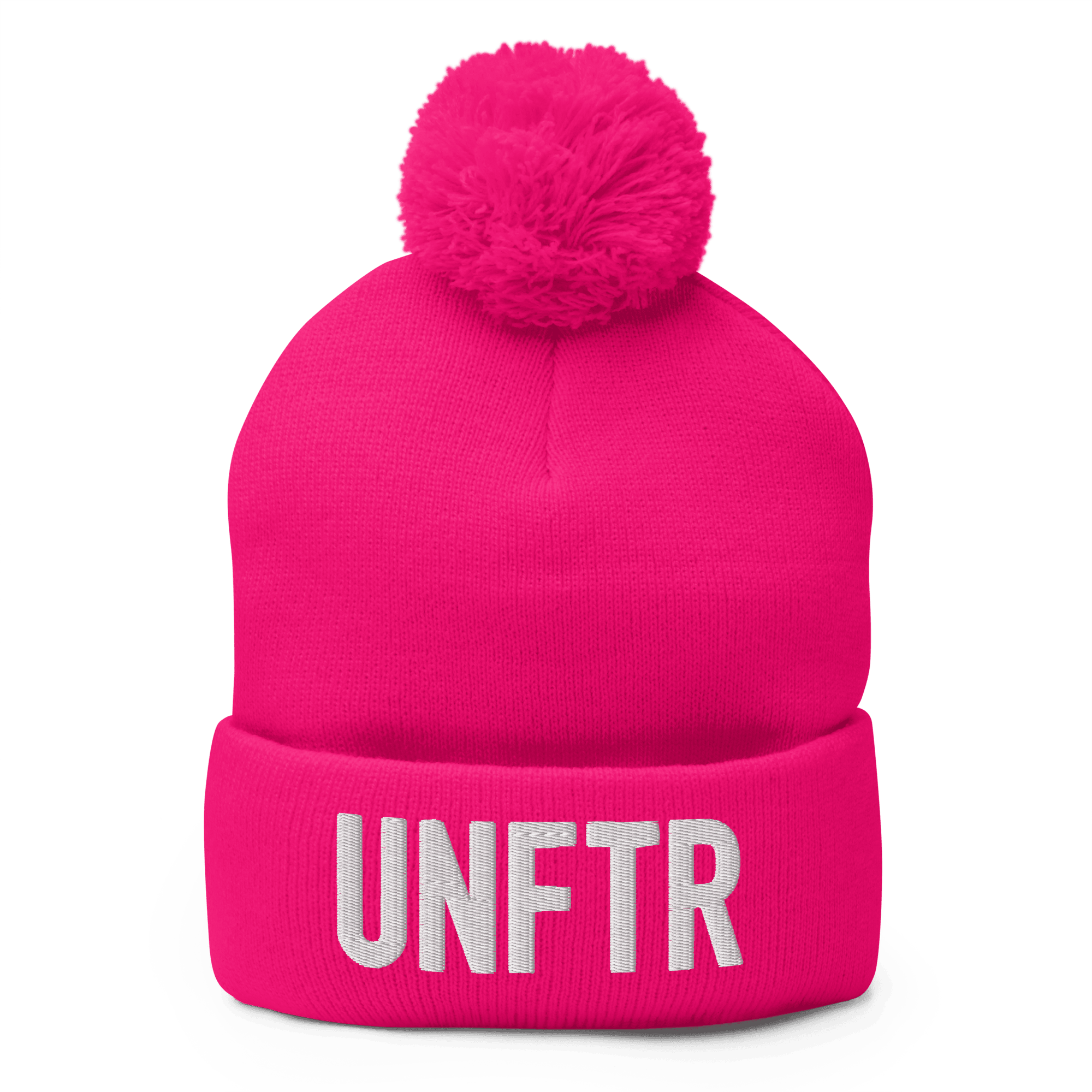 Hot pink cuffed beanie with a pink pom pom on top and embroidered white text that says UNFTR